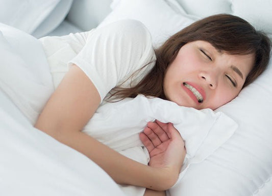 How to Stop Grinding Your Teeth in Your Sleep Naturally - City Mattress